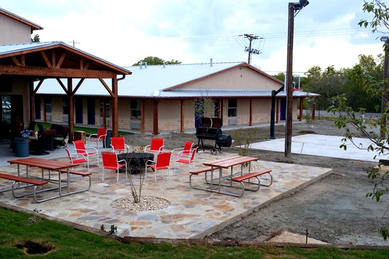 Just outside the covered patio is a large flagstone patio complete with fire pit and ample seating.